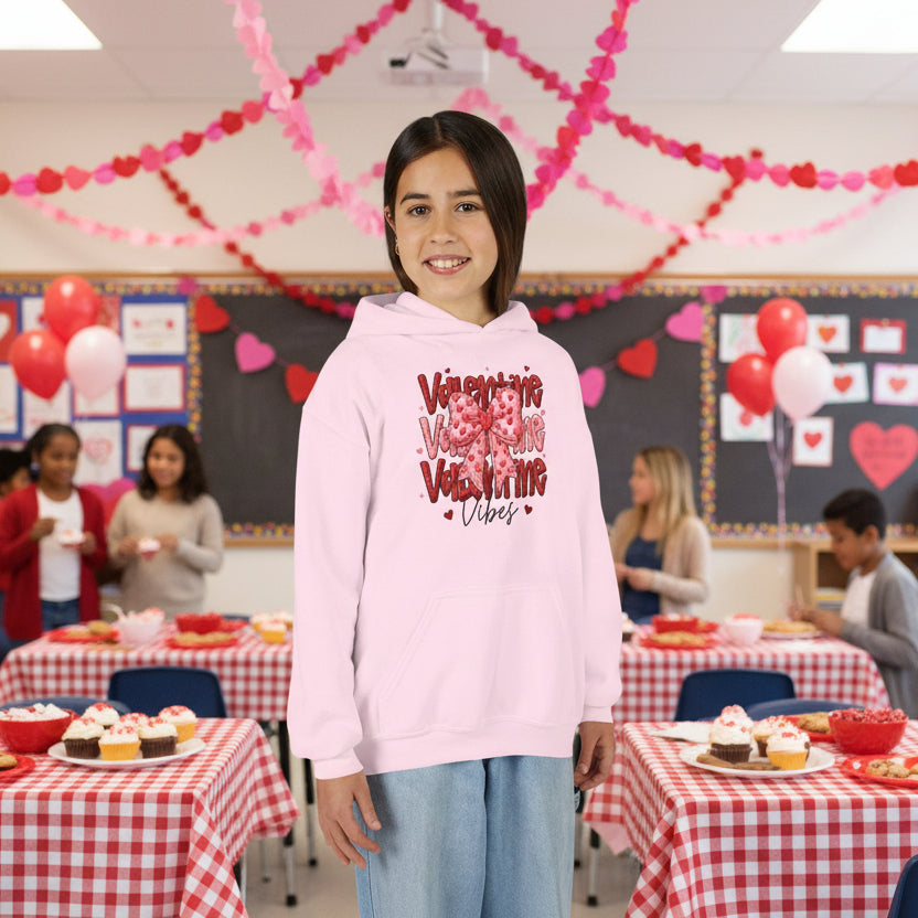 Girl wearing a pink hoodie with Valentine's Day design at a valentine party