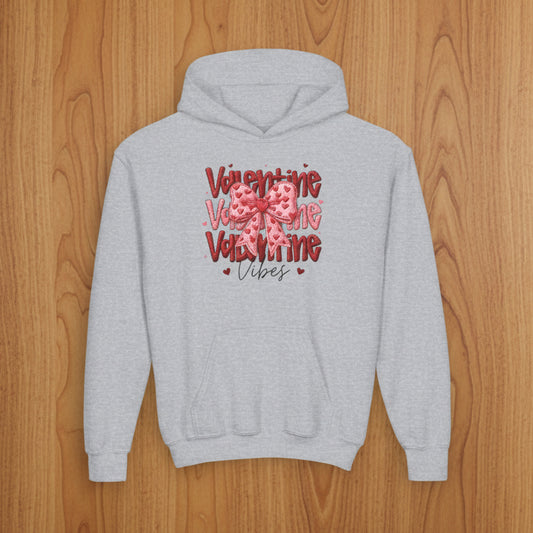 Gray hoodie with Valentine's Day design on a wood background