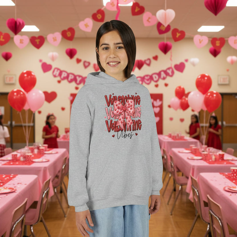 Person wearing a gray hoodie with valentine text at a school party