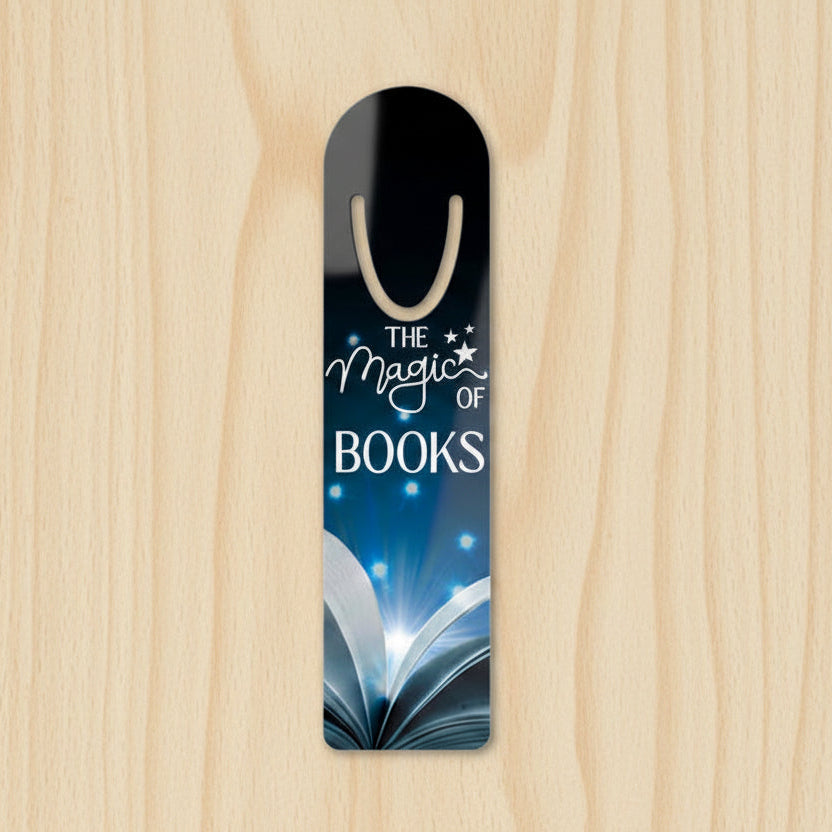 Aluminum bookmark with glowing open book and stars reading The Magic of Books
